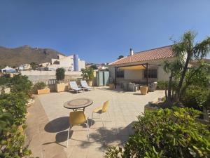 a patio with a table and two chairs and a table at Mirador de Bolnuevo in Bolnuevo