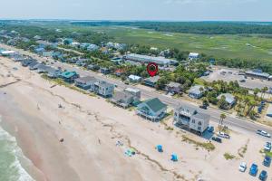 an aerial view of a beach with buildings and a road at The Edistoneyan in Edisto Island