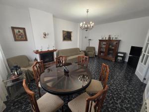 a living room with a glass table and chairs at Mirador de Bolnuevo in Bolnuevo