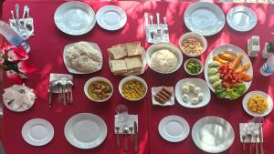 a table topped with plates and bowls of food at Galoya Red Lotus in Ampara