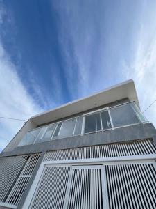 a tall building with windows on top of it at Apartamento em Garopaba in Garopaba