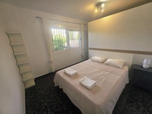 a bedroom with a bed with two towels on it at Mirador de Bolnuevo in Bolnuevo +53 photos
