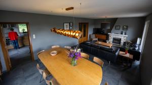 a living room with a wooden table and a couch at Lumen nr5 in Bois