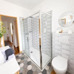 a bathroom with a shower and a toilet at Le Jeu de Paume - Bail Partner in Mailly-le-Château