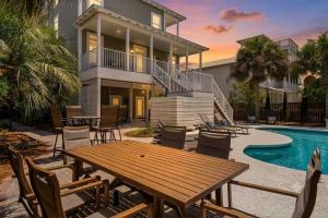 a house with a table and chairs and a pool at Blue Mountain View - Private Pool in Santa Rosa Beach