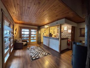 a large room with a kitchen and a living room at Hostal Lago Ranco Boutique in Lago Ranco +15 photos
