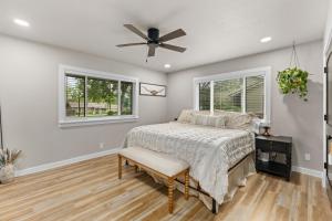 a bedroom with a bed and a ceiling fan at Boerne Birdie Ranch in Boerne