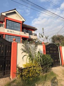 a house with a black gate and a fence at 2020 suites utawala in Nairobi