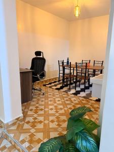 an office with a desk and chairs and a table at 2020 suites utawala in Nairobi