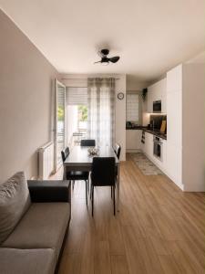 a living room with a couch and a table at Civico 8 in Bollate