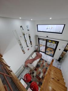 a living room with a couch and a window at 4 Rest in a warm and comfortable loft in Coihaique