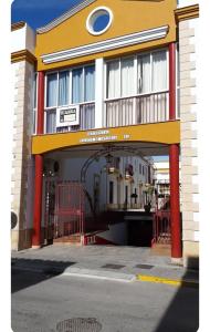 a building with a gate in front of it at Apartamento con Garaje, WiFi, Centro y playa in Chipiona