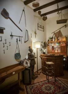 a room with a bar with a bear standing next to a lamp at Candalù - Villa Giardinata in Valderice