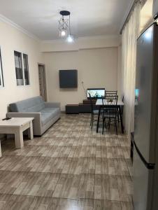 a living room with a couch and a table at At home in Yerevan