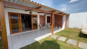 a patio of a house with glass doors at Villa Arcoíris in Paita