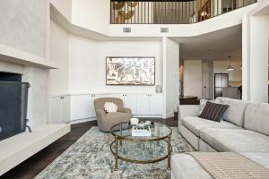 a living room with a couch and a table at Sunset Ridge Ranch - Pool Outdoor Kitchen & Views in Dripping Springs