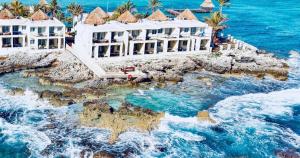an aerial view of a resort in the ocean at Mia Reef Isla Mujeres - All Inclusive Resort in Isla Mujeres