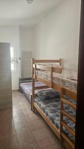 a bedroom with two bunk beds in a room at Apartman Andrej in Bar
