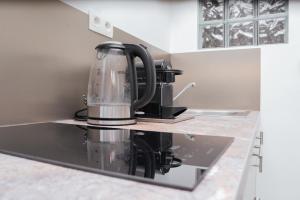 a coffee maker sitting on top of a kitchen counter at Alvastay - Cozy studio in Haaltert +9 photos