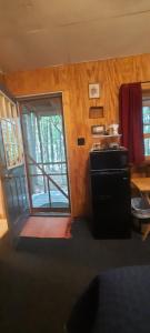 a room with a door leading to aoyer with a door at Thunder Ridge Cabins B&B - Bird Nest in Rockbridge