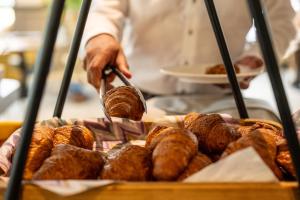 a baker is preparing croissants and other pastries at Hof van Alexander Boutiquehotel in Renesse