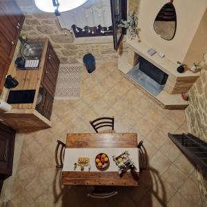an overhead view of a kitchen and a table with fruit on it at Olive Stonehouse Sea and Mountain View in Áyios Míron