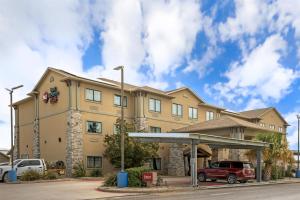 a hotel with a gas station in front of it at Best Western Plus Big Lake Inn in Big Lake