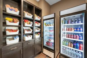 a refrigerator filled with lots of food and drinks at Best Western Plus Big Lake Inn in Big Lake