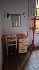 a room with a desk and a chair and a dresser at Casa Pugliese in Buenos Aires