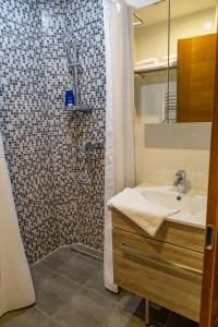 a bathroom with a shower and a sink at MONTANA in Jahorina +41 photos
