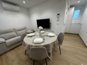 a living room with a table and a couch at O LAR DE DON BASILIO in Redondela