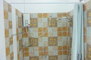 a shower with a hose in a bathroom at Mook Ing Lay in Ko Mook +37 photos