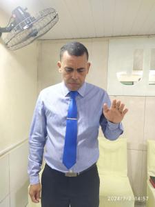 a man wearing a blue shirt and a blue tie at Borges in Cabo de Santo Agostinho
