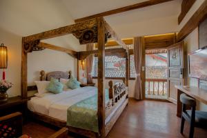 夕露小榭古城南门店 Xilu Xiaoxie Inn Old Town Lijiang客房内的一张或多张床位