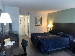 a hotel room with a bed and a desk at Anastasia Inn - Saint Augustine in St. Augustine +68 photos