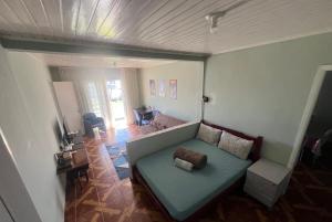 an overhead view of a living room with a couch at Casa Stepien ,Spacious House up to 11 guests in Fazenda Rio Grande Paraná Brazil in Fazenda Rio Grande