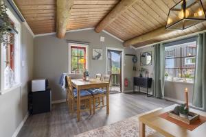 a living room with a dining room table and chairs at Kvila in Surnadal +13 photos