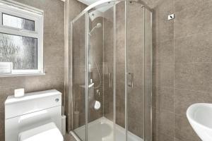 a bathroom with a shower and a toilet and a sink at 4 Bed in Ambleside oc-lr120 in Ambleside +23 photos