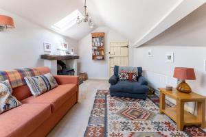 a living room with a couch and a chair at 1 Bed in Grasmere oc-lr124 in Grasmere +6 photos