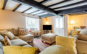 a living room with couches and a tv at 5 Bed in Hawkshead oc-lr134 in Hawkshead