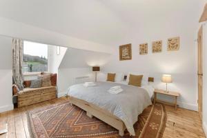 a bedroom with a large bed and a window at 3 Bed in Coniston oc-lr198 in Coniston