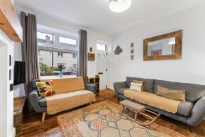 a living room with two couches and a window at 3 Bed in Coniston oc-lr198 in Coniston