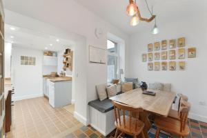 a kitchen and living room with a wooden table and chairs at 3 Bed in Coniston oc-lr198 in Coniston