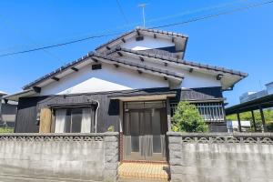 a black and white house with a fence at Okawaya - Vacation STAY 49372v in Ōkawa