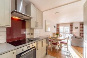 a kitchen with a table and a dining room at 2 Bed in Ambleside oc-lr114 in Chapel Stile +13 photos