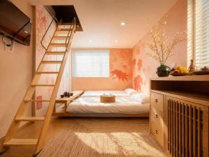 a bedroom with a bunk bed and a staircase at 刻宿Toki Stay Ueno in Tokyo +10 photos