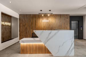 a lobby with a reception desk in a building at Apartamentos HOUSY Laureles in Medellín
