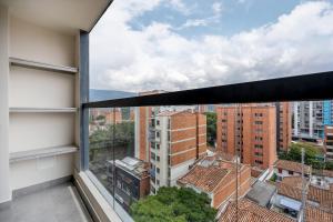 a view from the window of a building at Apartamentos HOUSY Laureles in Medellín