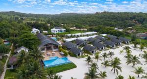 an aerial view of a resort with a pool and palm trees at You&Me Resort in Koh Rong Island