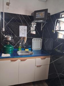 a kitchen with a sink and a counter top at Apto centrico in Dolores